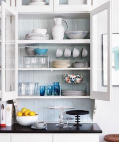 Dish cabinet with glass doors. Love the hanging mugs to save space and make it more visually interesting. I need to do this to the left of my stove/oven.