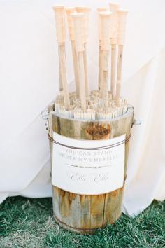 
                    
                        Provide parasols for an outdoor ceremony | @Kate Holstein | Brides.com
                    
                