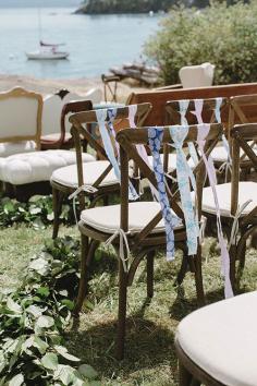 
                    
                        Colorful ribbons on classic cross back chairs are fun and playful | Brides.com
                    
                