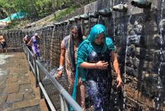 
                    
                        Devotees walk or run through the 108 holy fountains at Muktinath Temple, Nepal
                    
                