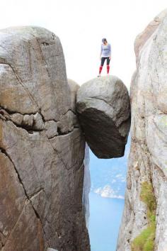 
                        
                            Hiking up to Kjeragbolten in Norway, a boulder wedged above a 3,000ft drop.
                        
                    