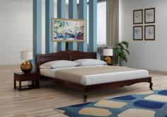 Get your hands on this wooden bed king size from PlusOne India. With its stylish design, this bed is sure to be the centerpiece of any bedroom, making a statement with its clean lines and attractive finish all over.