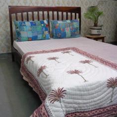 Explore the charm of Indian patchwork quilts online at Roopantaran. Our collection showcases exquisite cotton quilts with intricate designs and vibrant colors, encapsulating the essence of traditional craftsmanship. Transform your bedding with these unique and cozy quilts that narrate tales of Indian artistry.