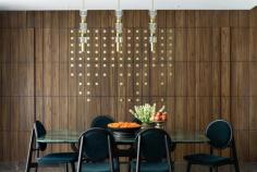 Perched above Chennai’s Adyar River, Nesavu — a 2,500 sq. ft. apartment designed by 1405 Design Studio — weaves tradition and modern living into one seamless narrative. From inlaid Kolams and terrazzo flooring to marigold-embroidered curtains and a sliding Pichwai mural, the home blends craft, culture, and contemporary design. Oxide-finished walls meet Udaipur green marble, while flexible spaces shift between studio, study, and dance floor, reflecting the lives of its owners — an entrepreneur and a Bharatanatyam dancer. Nesavu is not just a residence but a woven story of memory, ritual, and quiet elegance.